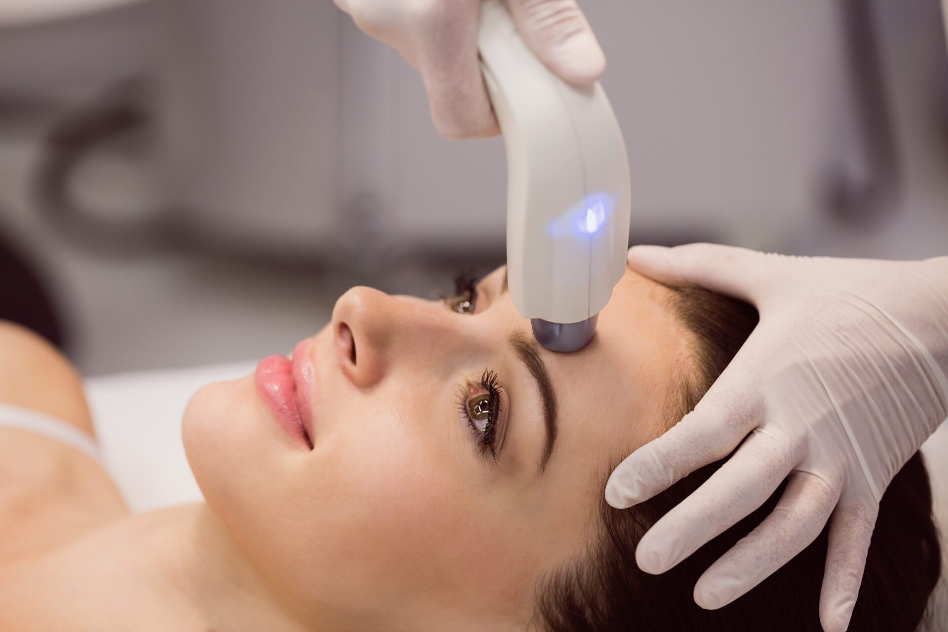 Female patient receiving cosmetic treatment at clinic